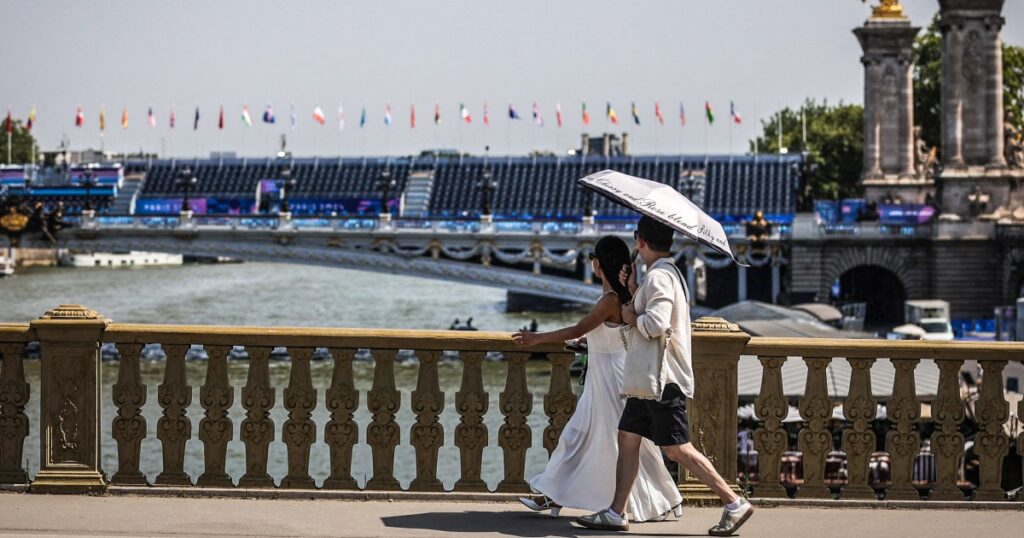 Triathletes swim in Seine for Paris Olympics as last-minute testing shows the river is safe