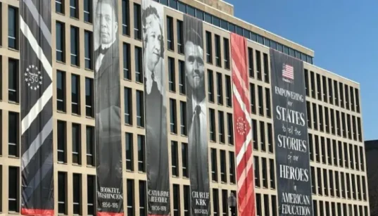 Charlie Kirk’s Banner at U.S. Education Department Sparks Debate